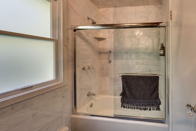 bathroom featuring enclosed tub / shower combo