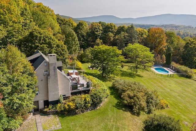 birds eye view of property featuring a mountain view