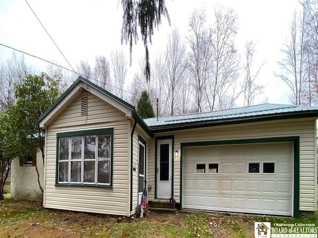 single story home with a garage