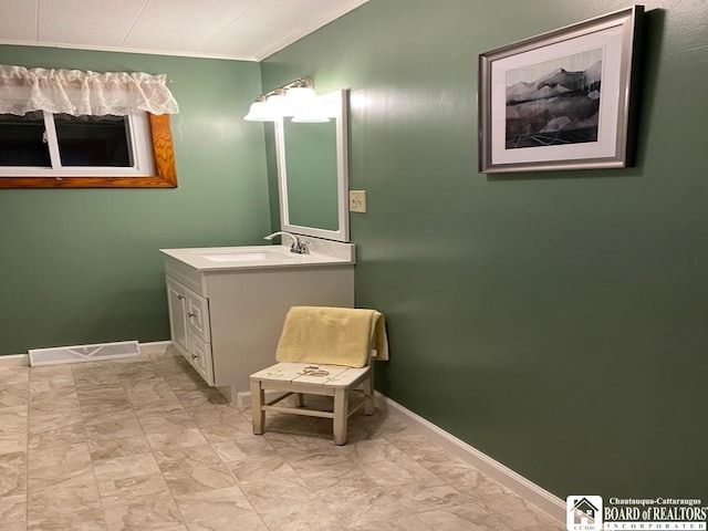 bathroom featuring vanity and ornamental molding