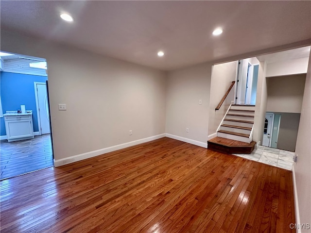 basement featuring hardwood / wood-style floors