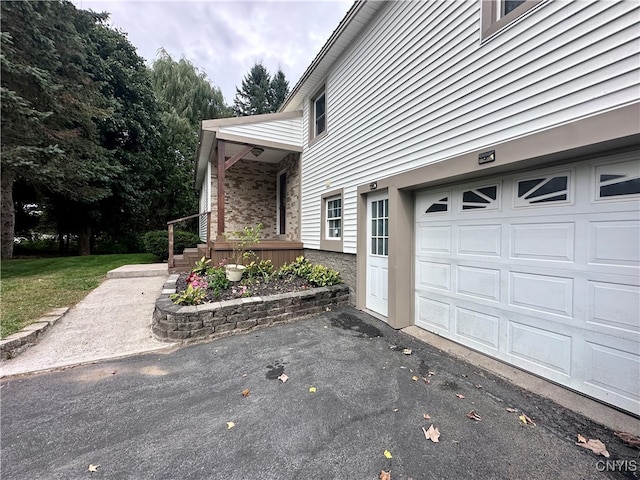 view of side of property with a yard and covered porch