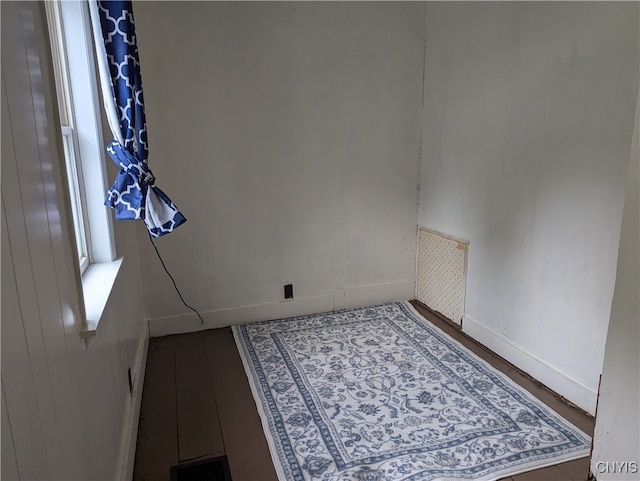 empty room with hardwood / wood-style floors