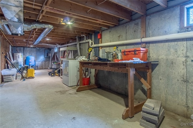 basement featuring washer / clothes dryer and electric water heater