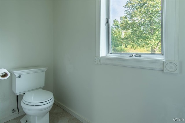 bathroom featuring toilet and tile patterned floors