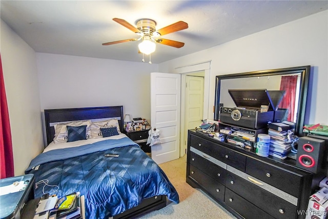 bedroom featuring ceiling fan and light colored carpet