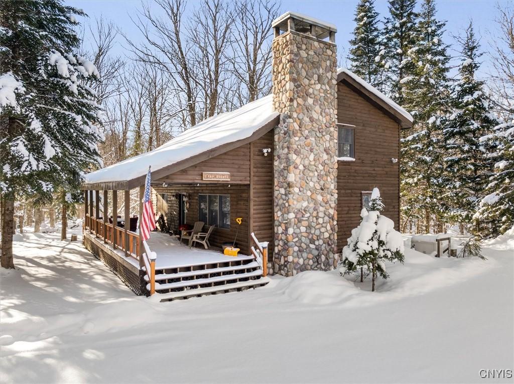 view of snow covered house