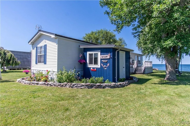 view of property exterior featuring a yard and a deck