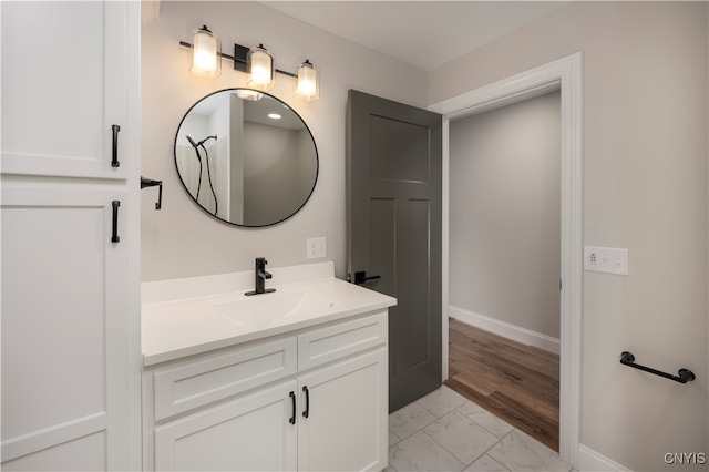 bathroom featuring wood-type flooring and vanity