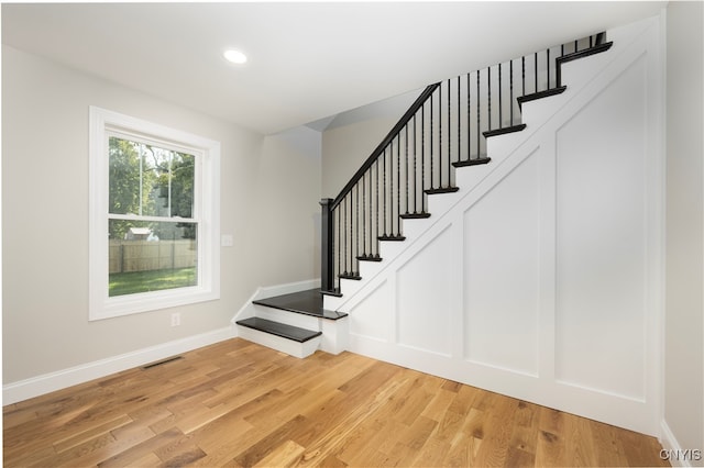 stairway featuring hardwood / wood-style flooring