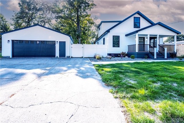 view of front of home with a porch and a lawn