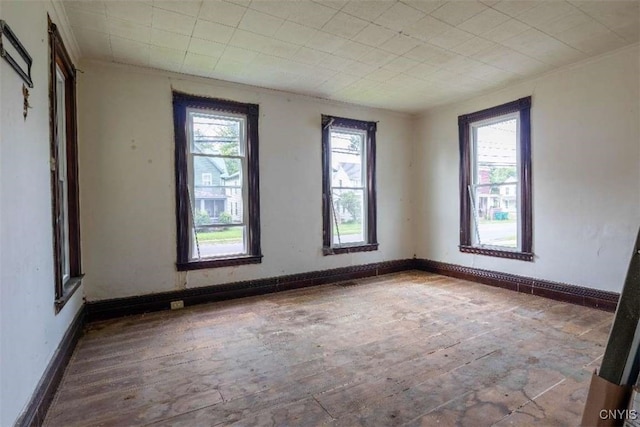 unfurnished room with wood-type flooring