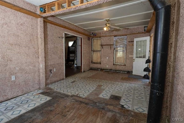 interior space with ceiling fan and hardwood / wood-style flooring