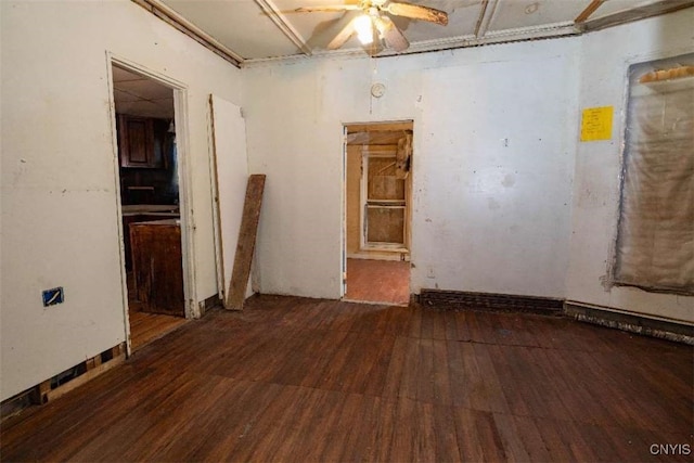 unfurnished room with dark hardwood / wood-style flooring and ceiling fan