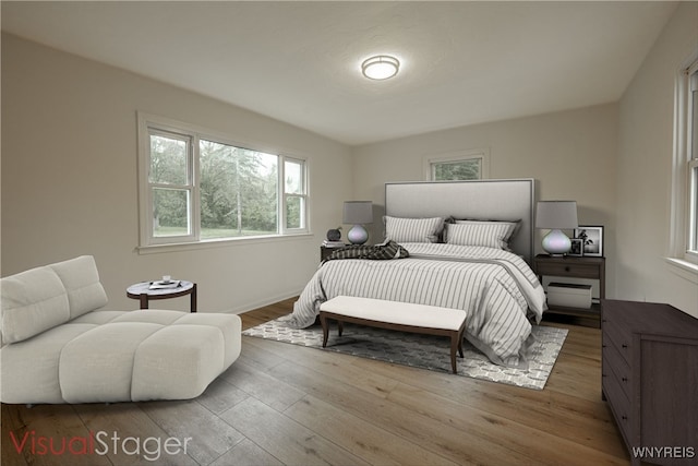 bedroom with hardwood / wood-style floors