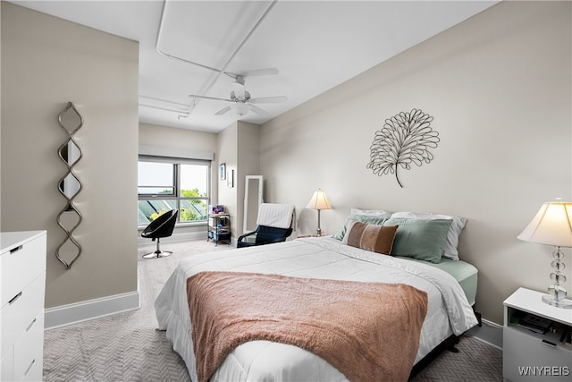 bedroom featuring ceiling fan and light colored carpet