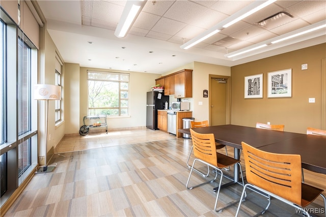 dining room with a paneled ceiling