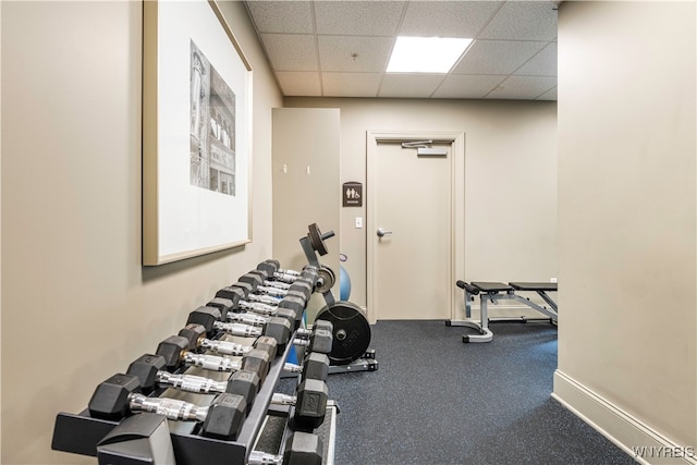 gym featuring a paneled ceiling