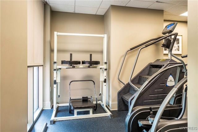 exercise area featuring a drop ceiling