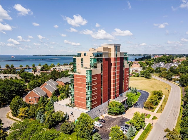 birds eye view of property with a water view