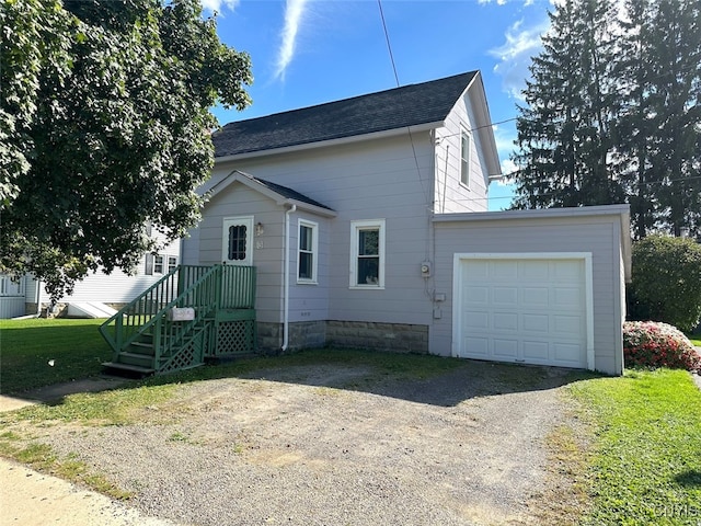 view of home's exterior with a yard and a garage