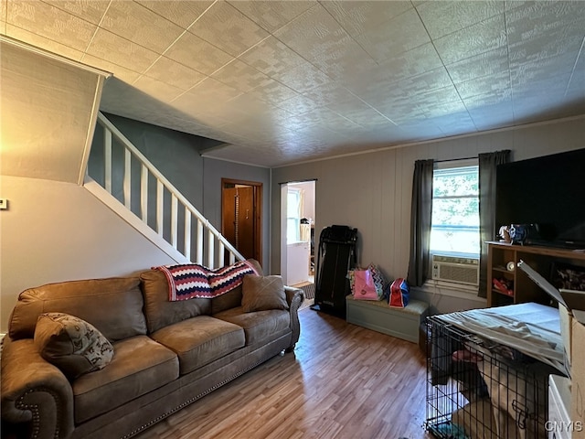 living room featuring cooling unit and hardwood / wood-style floors