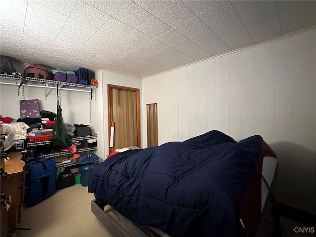 bedroom with wood walls