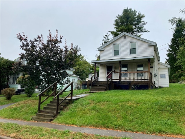 view of front facade with a front yard and a porch