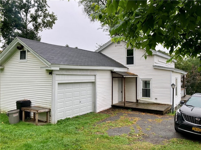 view of front of house featuring a deck and a garage