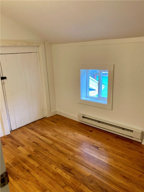 interior space featuring light hardwood / wood-style floors and baseboard heating