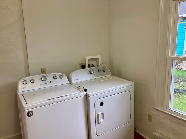 laundry area with washing machine and clothes dryer