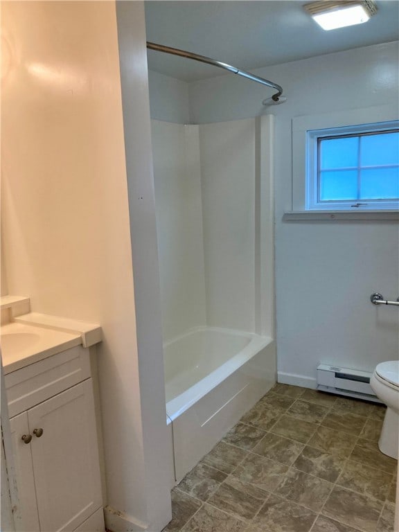 full bathroom with vanity, washtub / shower combination, toilet, and a baseboard heating unit