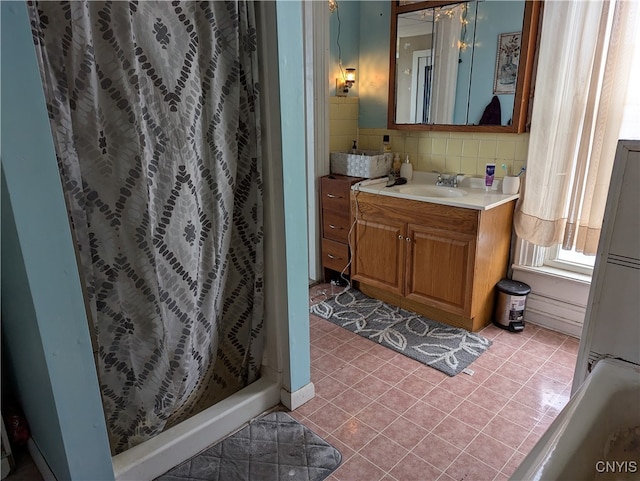 bathroom with backsplash, vanity, tile patterned floors, and a shower with curtain