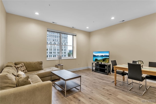 living room with light hardwood / wood-style flooring