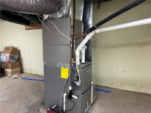 utility room featuring heating unit