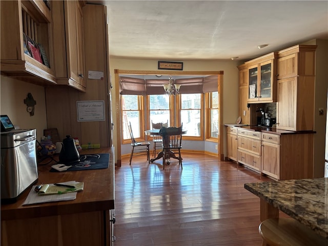 kitchen featuring a chandelier and dark hardwood / wood-style flooring