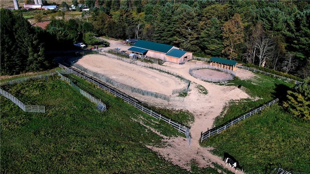 birds eye view of property with a rural view