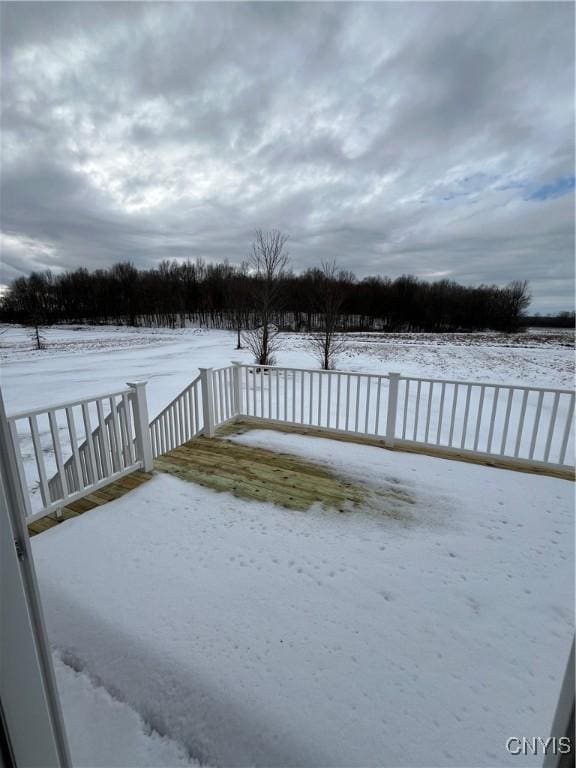 view of snow covered deck