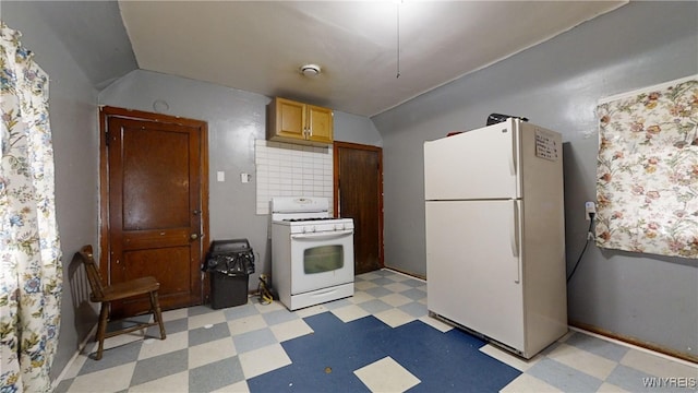 kitchen featuring white appliances, vaulted ceiling, light brown cabinetry, and tasteful backsplash