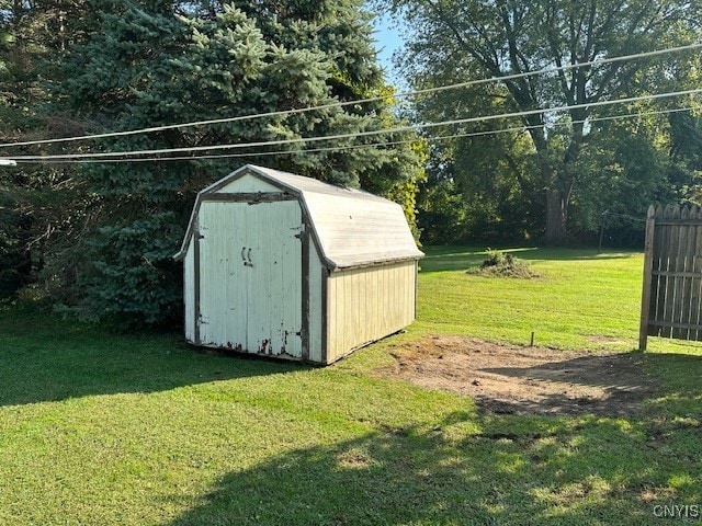 view of outbuilding featuring a yard