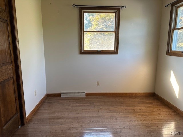 spare room with light wood-type flooring