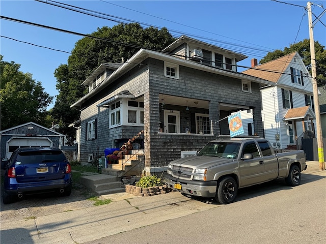 view of front of home with an outdoor structure and a garage