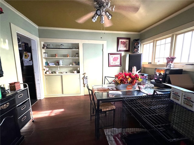 dining space featuring ceiling fan, a textured ceiling, crown molding, and dark wood-type flooring