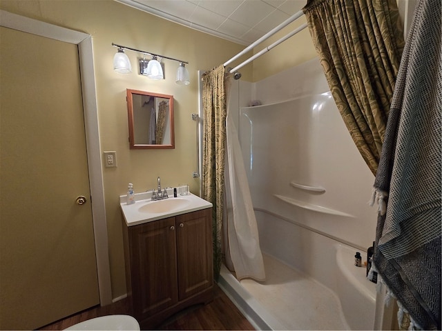 bathroom featuring hardwood / wood-style floors, vanity, toilet, and a shower with curtain