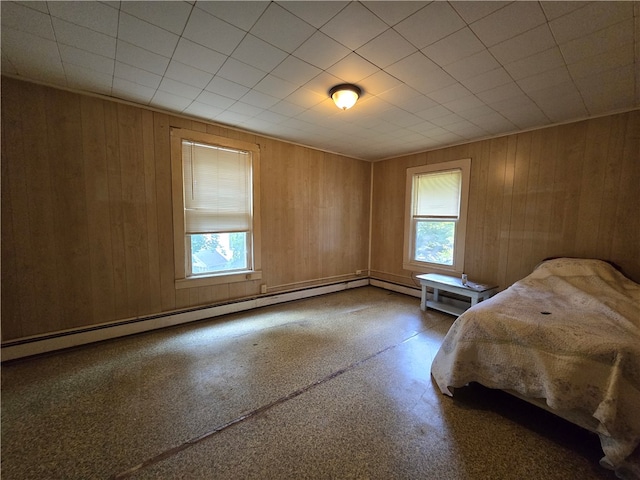 unfurnished bedroom with wooden walls