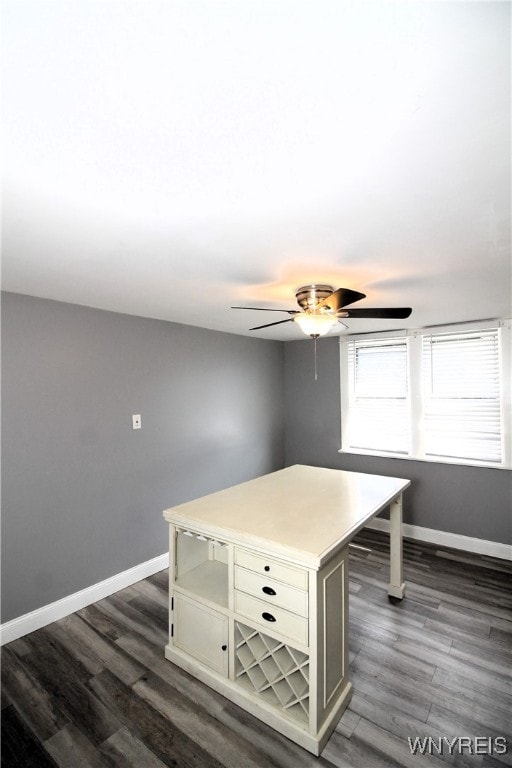 interior space with ceiling fan and dark wood-type flooring