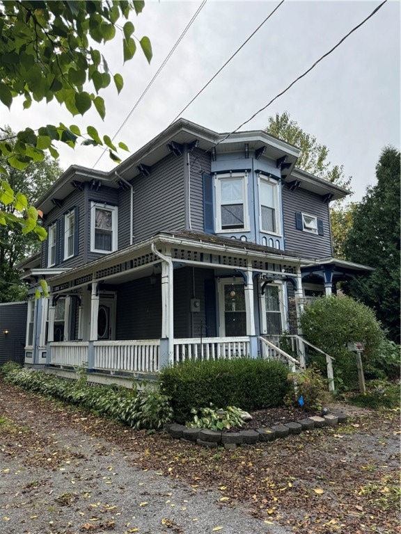 view of side of home featuring a porch