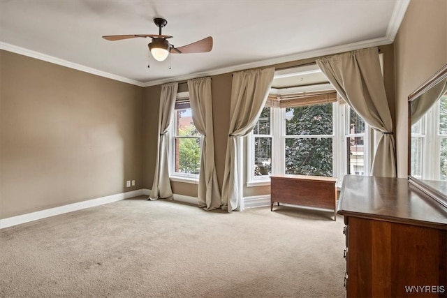 interior space featuring light carpet, ceiling fan, and crown molding