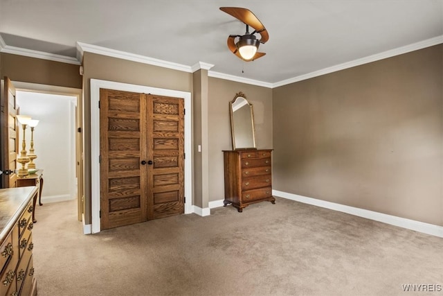 unfurnished bedroom featuring crown molding, ceiling fan, and light colored carpet