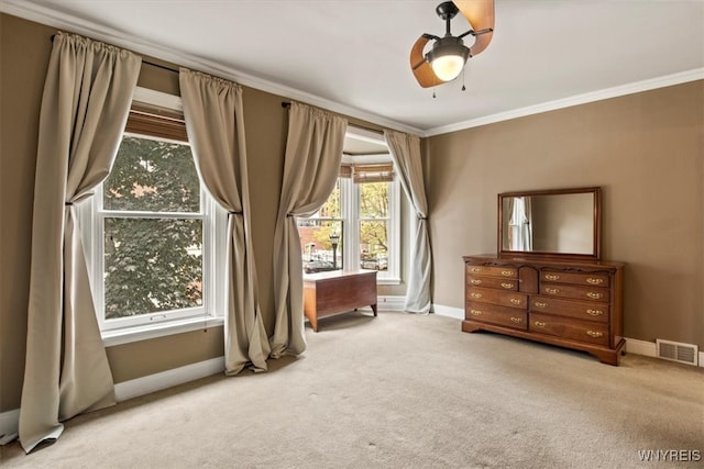 miscellaneous room featuring ornamental molding, ceiling fan, and light colored carpet